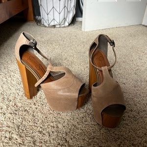Jessica Simpson brown platform heels with ankle straps.